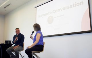 Ian Simpson, CEO of Petroglyph Development Group, talks social finance with Kristi Fairholm Mader, Managing Director of Thrive Impact Fund, during a keynote conversation at Connect Money Impact Nanaimo 2026.